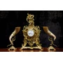 Antique clock of mantel with two animal horn vases 