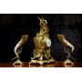 Antique clock of mantel with two animal horn vases 