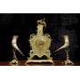 Antique clock of mantel with two animal horn vases 